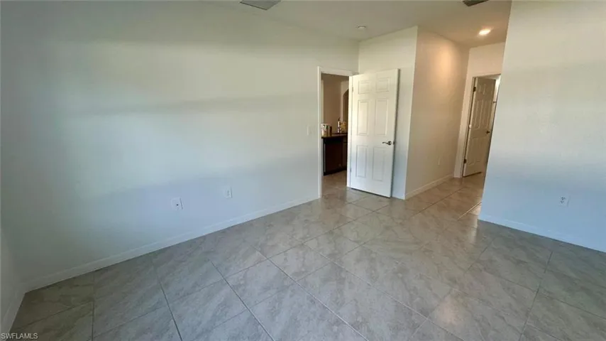 Unfurnished room featuring baseboards