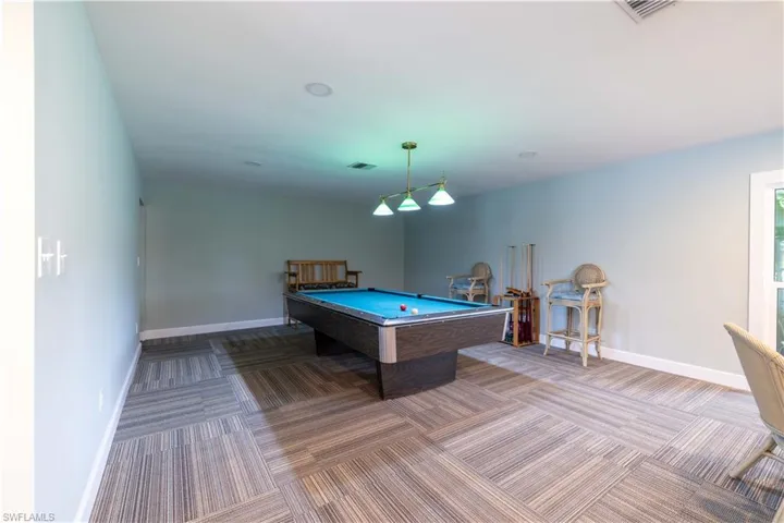 Game room featuring billiards and carpet