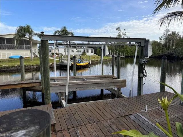 Dock area featuring a water view