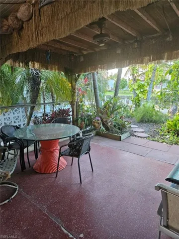 View of patio with tiki roof
