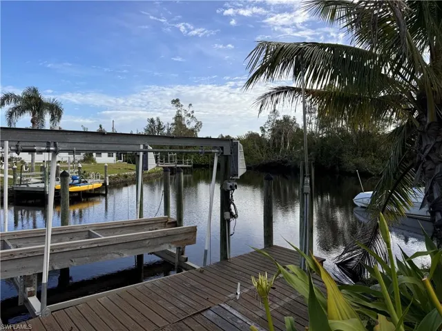 Dock area featuring a water view