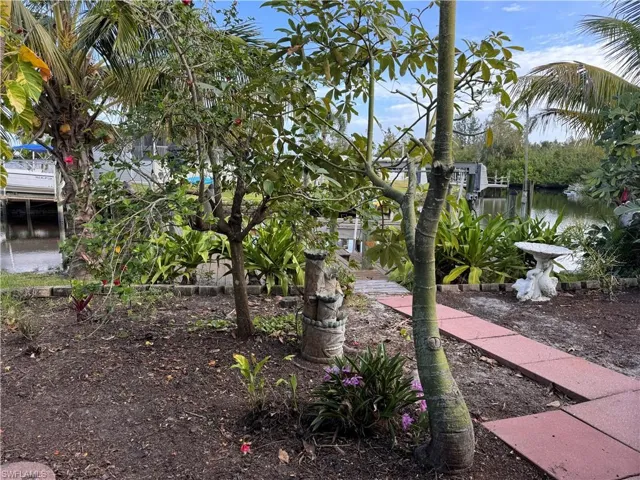 View of yard with a water view