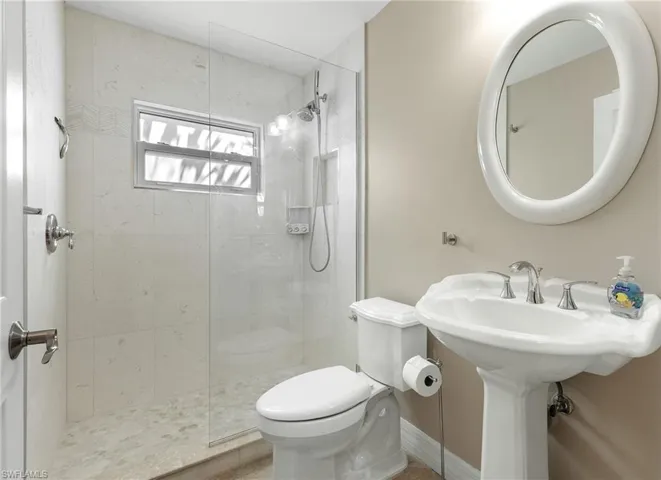 Bathroom featuring walk in shower and tile patterned floors