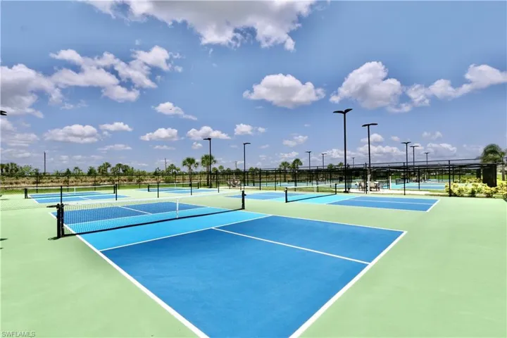 View of tennis court featuring community basketball court