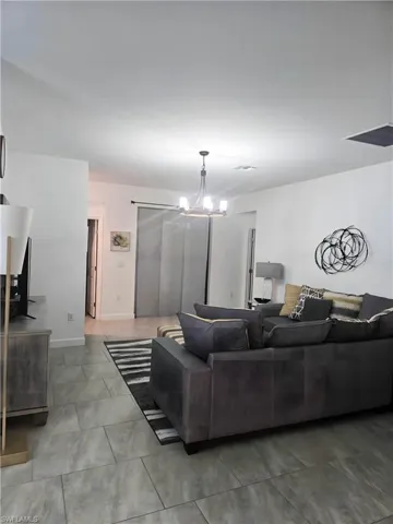 Living area featuring a chandelier