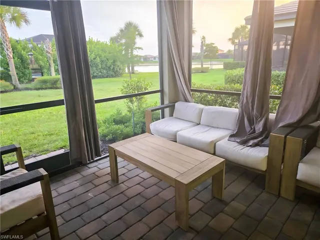 Sunroom / solarium featuring an outdoor living space