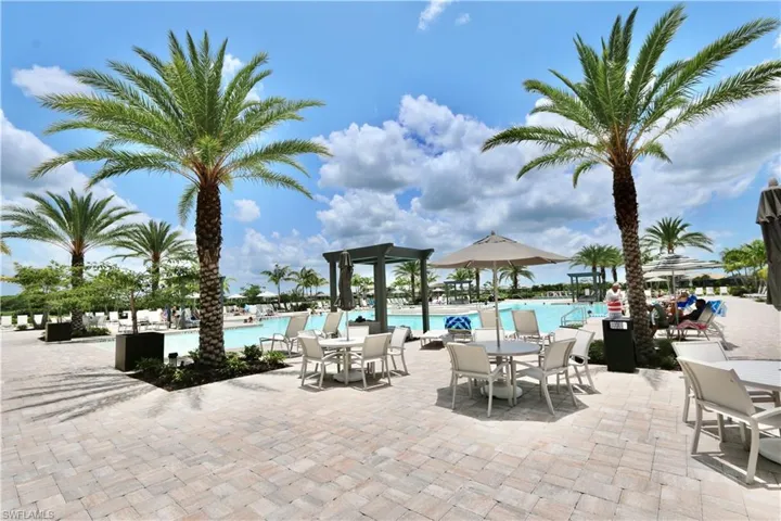 Community pool with outdoor dining area