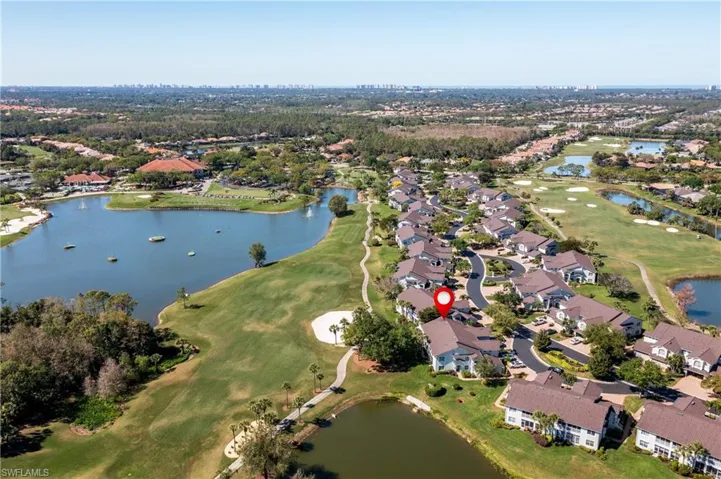 Bird's eye view featuring view of golf course, a water view, and a residential view