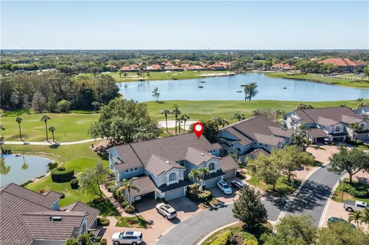 Bird's eye view featuring golf course view, a water view, and a residential view.