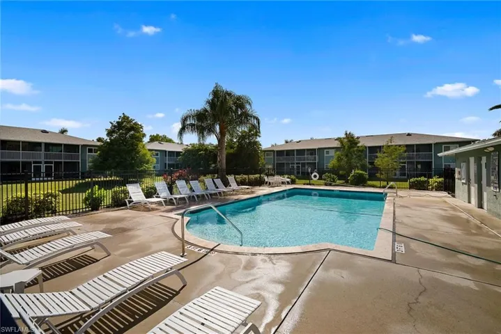 Community pool with a patio area