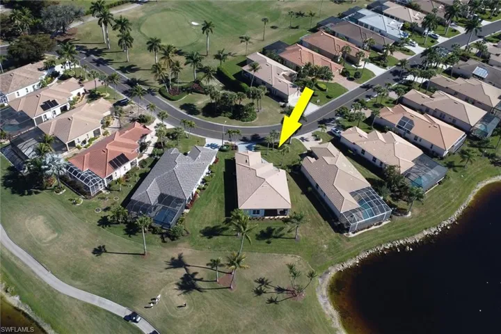 Aerial perspective of suburban area featuring a local golf course