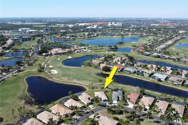 View of property location featuring nearby suburban area and a large body of water