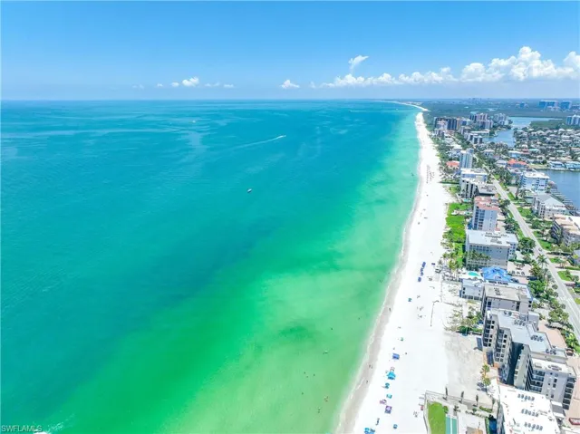 Aerial view with a beach view and a water view