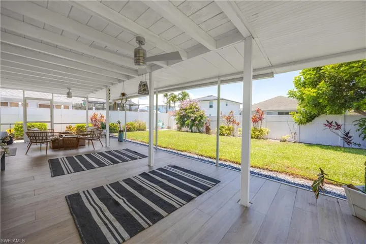 Outdoor patio with ceiling fan