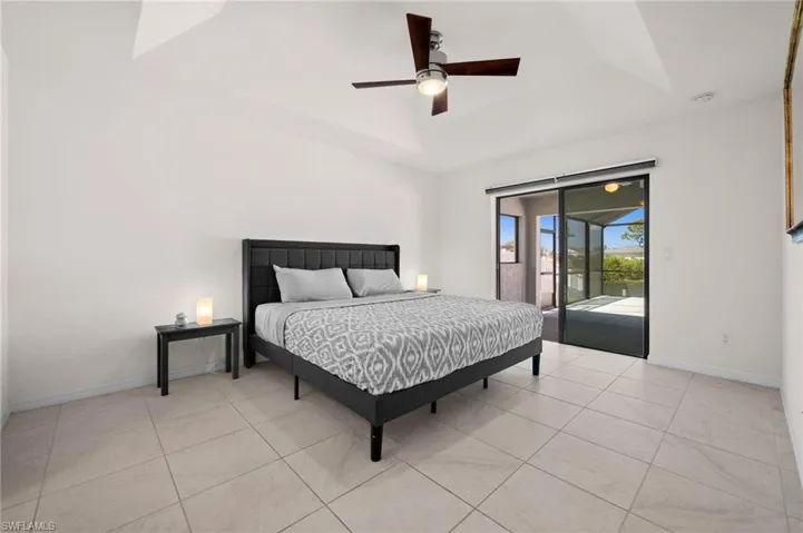 Primary Bedroom just steps to the lanai and pool