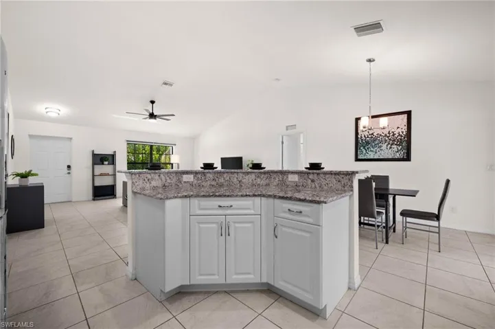 The island with breakfast bar is central to the main living area