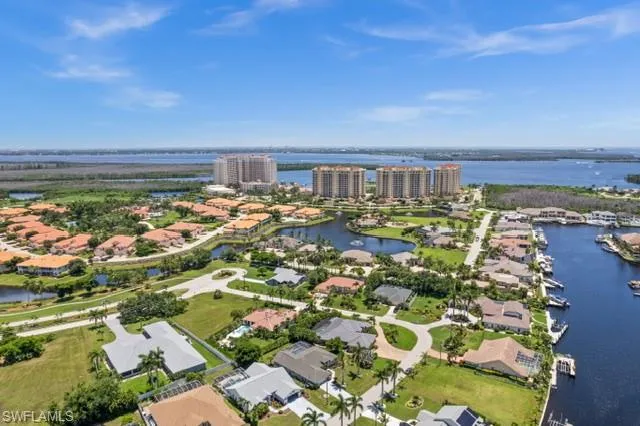 Birds eye view of property featuring a water view