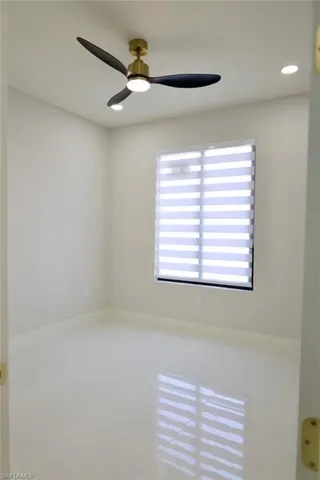Empty room featuring recessed lighting and a ceiling fan