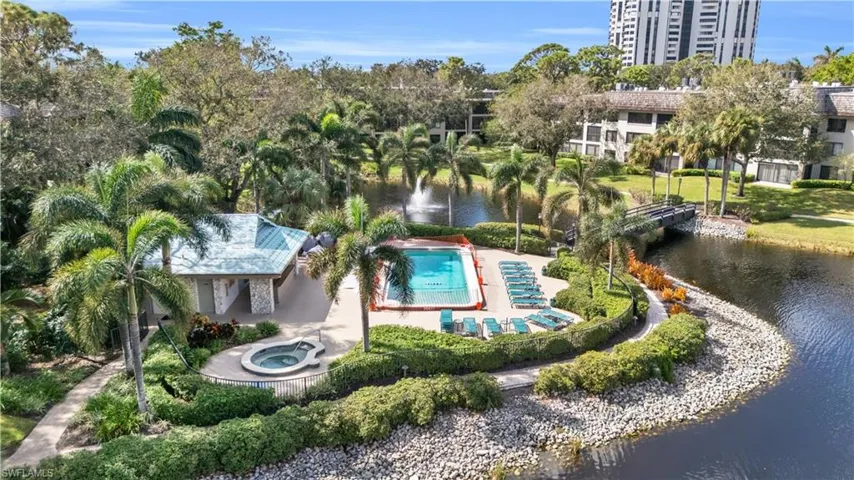 Aerial view of a nearby body of water and a pool