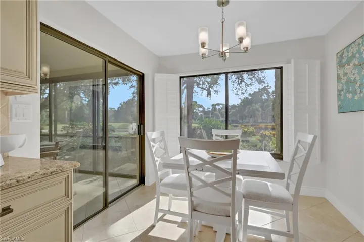 Dining room featuring a chandelier and light tile patterned floors