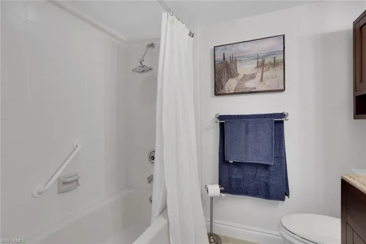 Full bath featuring vanity and shower / tub combo