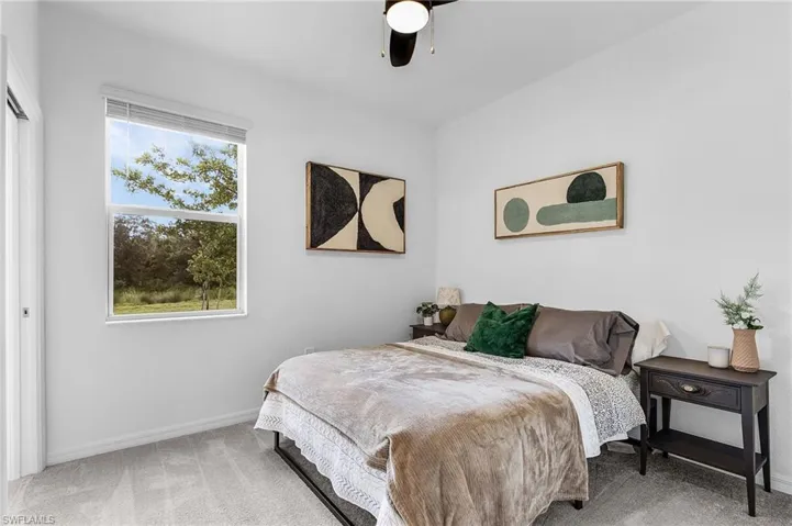 Bedroom featuring carpet floors and ceiling fan