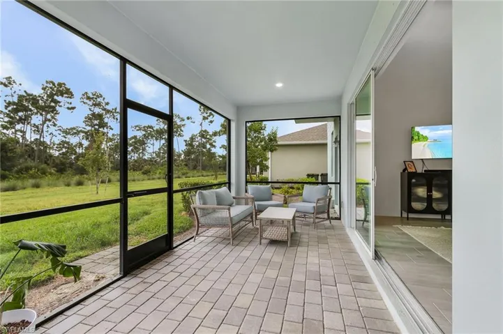 Sunroom / solarium featuring an outdoor living space