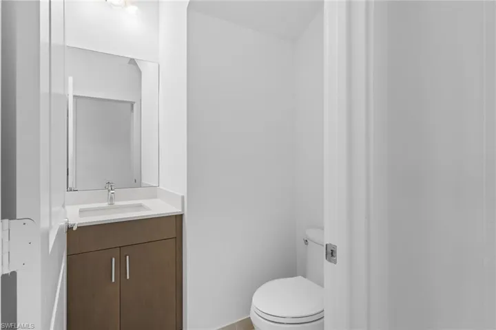 Bathroom featuring vanity and toilet