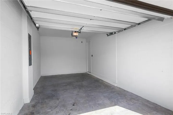 Garage with concrete block wall and electric panel