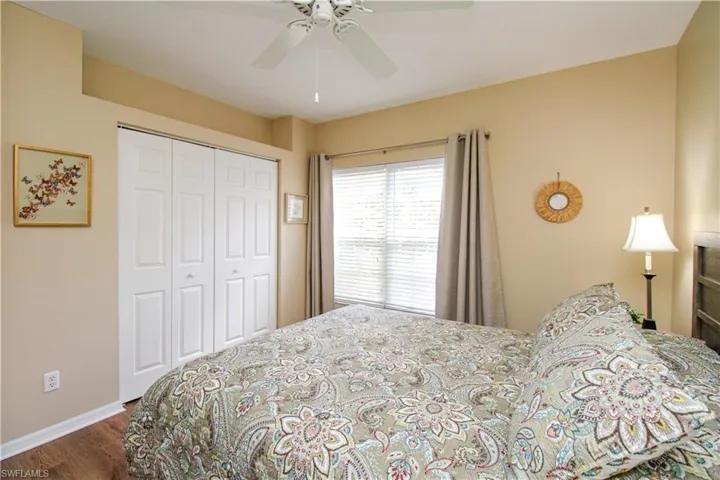 Bedroom featuring a closet, ceiling fan, and hardwood / wood-style floors