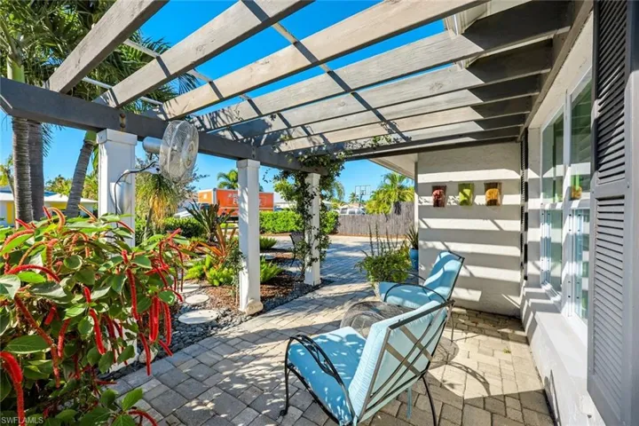 Front sitting area with pergola.