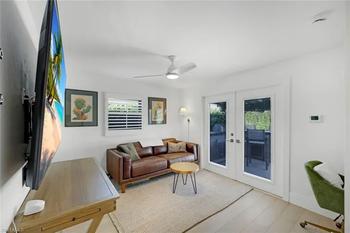 Back room with access to back patio and pool area.