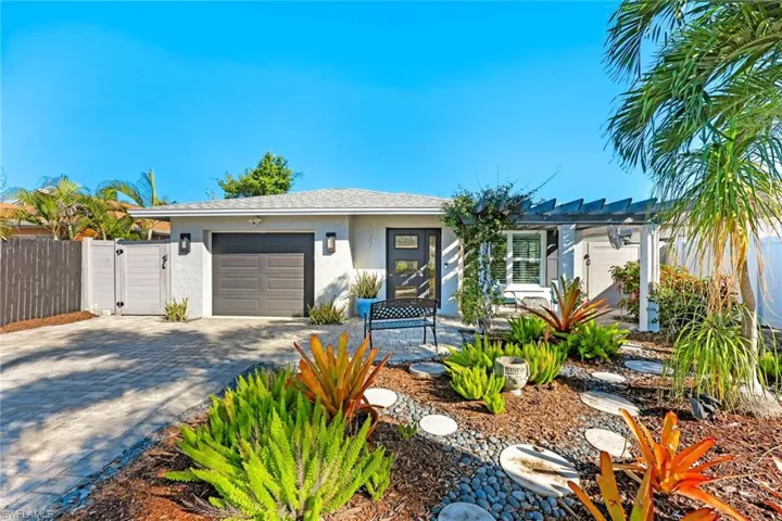 Front yard with lovely landscaping up to your front door.