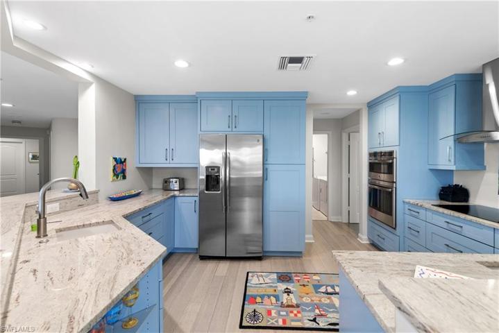 This spacious kitchen has plenty of storage and newer appliances.