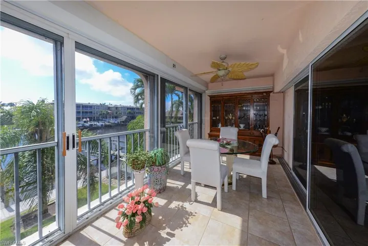 Sunroom / solarium with plenty of natural light and ceiling fan
