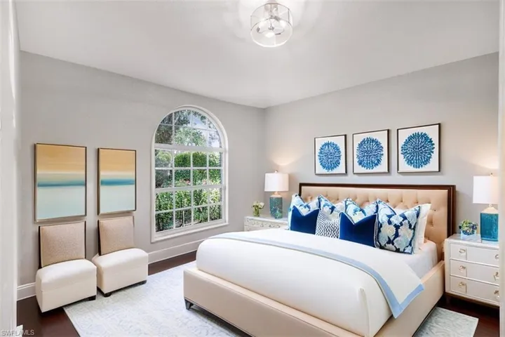 Bedroom with hardwood / wood-style flooring