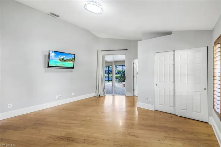 Unfurnished bedroom featuring light hardwood / wood-style floors and access to exterior
