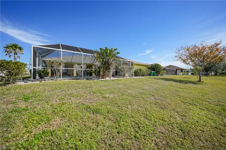 View of yard featuring a lanai