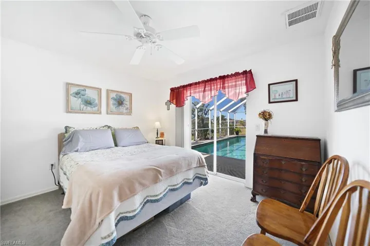 Bedroom featuring ceiling fan, carpet, and access to outside
