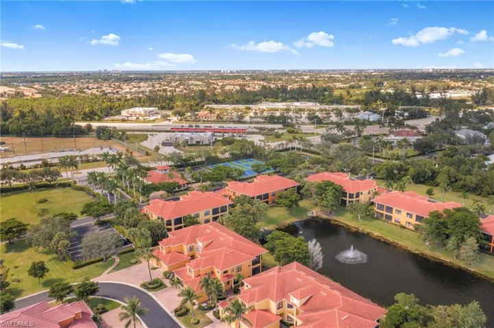 Bird's eye view of a nearby body of water and a tree filled landscape