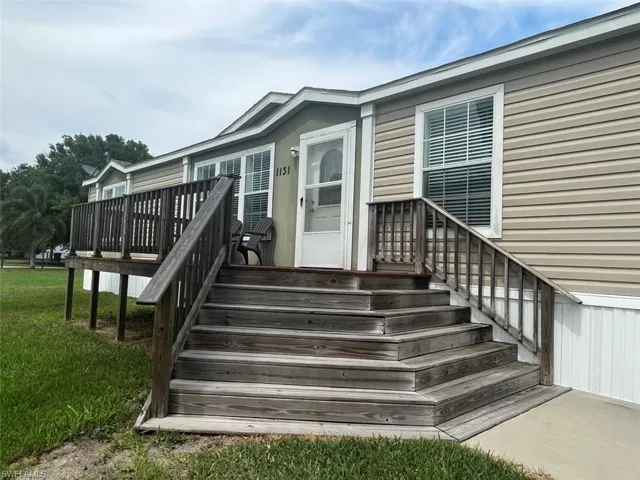 Property entrance featuring a lawn