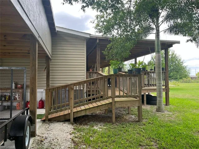 Wooden terrace with a lawn