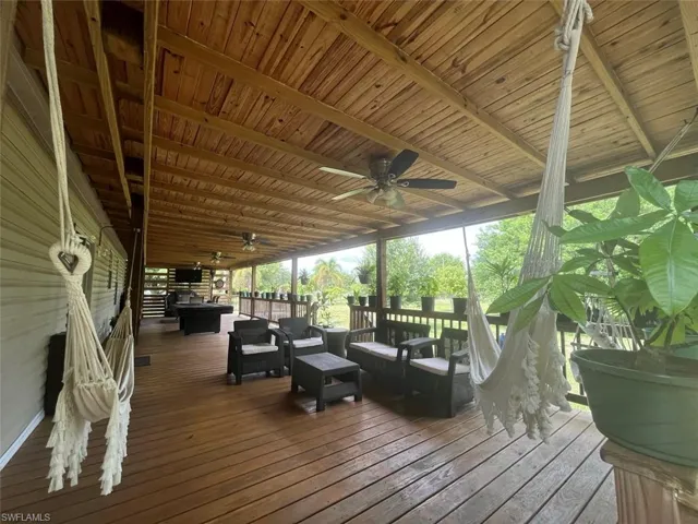 Deck featuring ceiling fan and outdoor lounge area