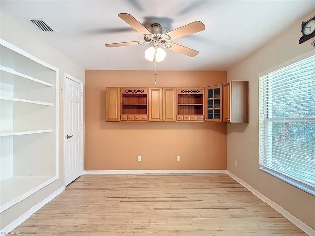 Spare room with ceiling fan and light hardwood / wood-style flooring
