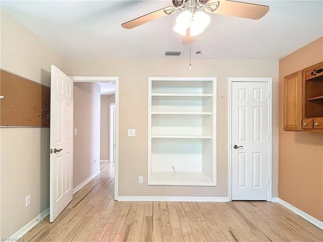 Unfurnished bedroom featuring ceiling fan and light hardwood / wood-style floors