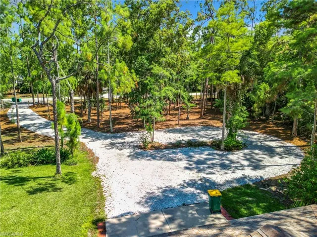 View of home's community with a lawn
