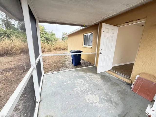 View of patio / terrace featuring a sunroom