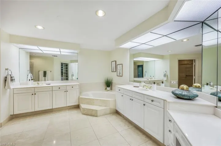 Primary bathroom has dual sinks, huge soaking tub, vanity and separate walk inshower.