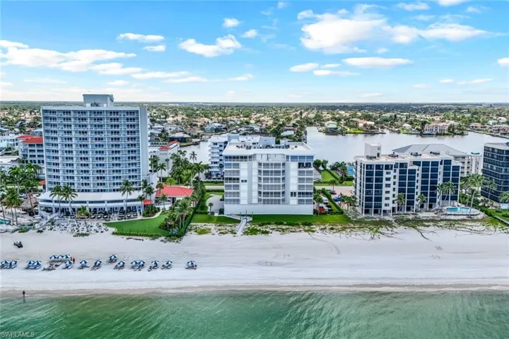 Drone / aerial view featuring a beach view and a water view