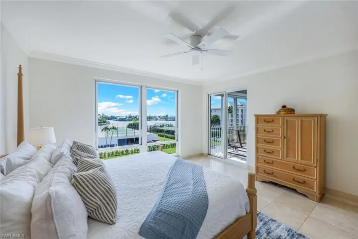 Second bedroom faces the bay, pool, and tennis court. Every window hasbeautiful views.